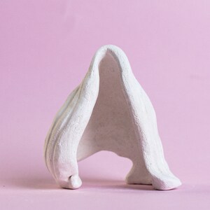 ceramic sculpture walking,statuette,art collecting,clay figures,minimalism,Minimalist Living Room Decoration.ceramic sculpture abstract