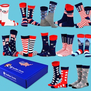 May include: A selection of socks featuring patriotic designs, such as stars, stripes, and the American flag, in red, white, and blue. The image also includes a blue box with the text "TeeHee Socks".