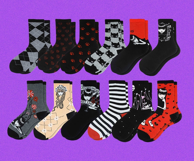 May include: A set of 12 colorful socks with various patterns, including hearts, paw prints, stripes, and illustrations of a girl with a crown and a girl with a cat. The socks are all ankle-length and have a variety of colors, including black, white, red, pink, and blue.