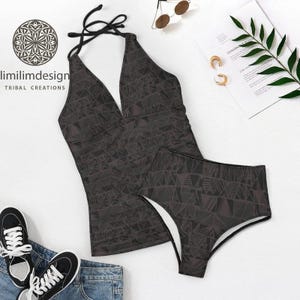 May include: A two-piece swimsuit set in dark grey, featuring a halter top and high-waisted bottoms. The fabric has a geometric triangle pattern. The brand name "limilimdesign" is printed on the top left.