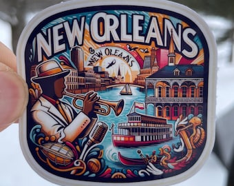 May include: A colorful sticker featuring a jazz musician playing a trumpet in front of a New Orleans cityscape. The design includes a steamboat, a river, and the text "NEW ORLEANS". The sticker has a white border and a rectangular shape with rounded corners.