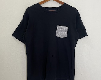 T-shirt vintage Number Nine T-shirt vintage Number Nine avec une poche T-shirt vintage Number Nine avec une poche ras du cou Taille S