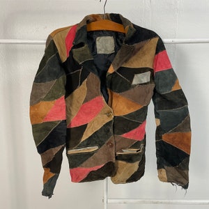 Vintage omärkt läderjacka i patchwork-stil Vintage omärkt läderjacka i patchwork-stil med knappar Storlek XS