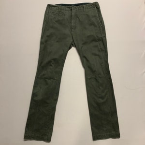 May include: A pair of dark green cargo pants with a straight leg fit.