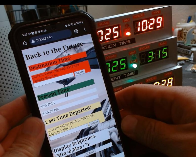 May include: A smartphone screen displaying a "Back to the Future" themed app with a digital clock interface. The app allows users to set a destination time, present time, and last time departed. The screen also shows a display brightness setting. The phone is held in front of a vintage-style digital clock with a red and green display.