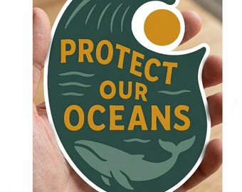 May include: A sticker with a green and white wave design, a yellow sun, and the words "PROTECT OUR OCEANS" in orange. A whale illustration is at the bottom. The sticker is held in a hand.