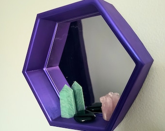 Colección de espejos y estantes hexagonales