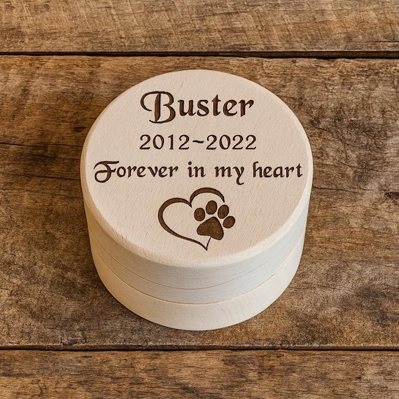A personalised engraved wooden mini urn keepsake for a dog's ashes or fur — quietly meaningful and something grieving pet owners genuinely search for.
