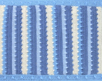 Crochet baby blanket  in shades of blue and cream.Handmade in Ireland by designer Bridie Hodge of Go Buboze