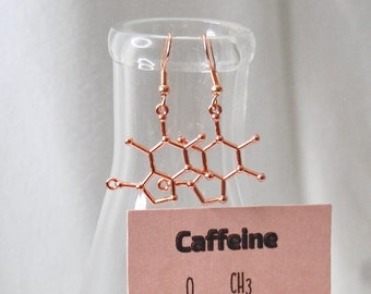 Pendientes de molécula de cafeína en oro rosa: un regalo de joyería científica