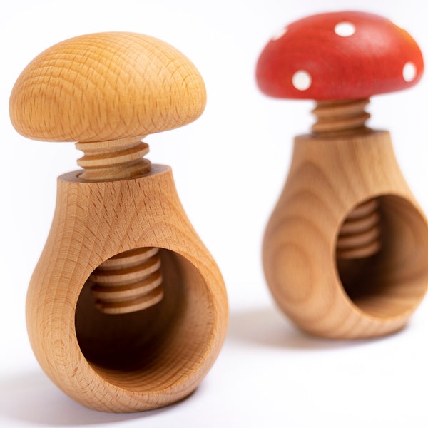 Wooden mushrooms with a screw. Montessori wooden baby toy. Toddler's fine motor skills development.