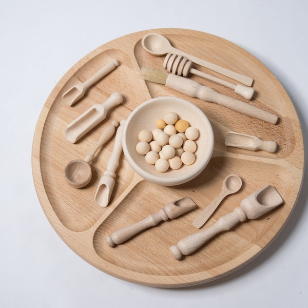 Open ended wooden kitchen utensils for kids. Montessori treasure basket for role play and sensory play.