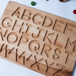 Reversible English alphabet board with directional arrows. Wood tracing and literacy board. Capital and and Lower case. Montessori alphabet