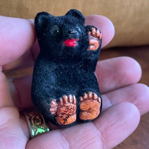 Tiny Waving Black Bear Souvenir of Lake Louise, British Columbia, Canada - made of ceramic for Rocky Mountain Novelties, Victoria, BC.