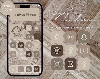 May include: A smartphone screen displaying app icons, widgets, and wallpapers in a light academia theme. The icons are in shades of brown and beige, with the text "in libras libertas" at the top. The image also includes the text "1200+ ICONS" and "Light academia".
