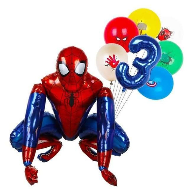 May include: A large, red and blue Spider-Man foil balloon in a crouching pose, with a cluster of colorful balloons. The cluster includes a blue number 3 balloon and balloons with superhero-themed graphics.