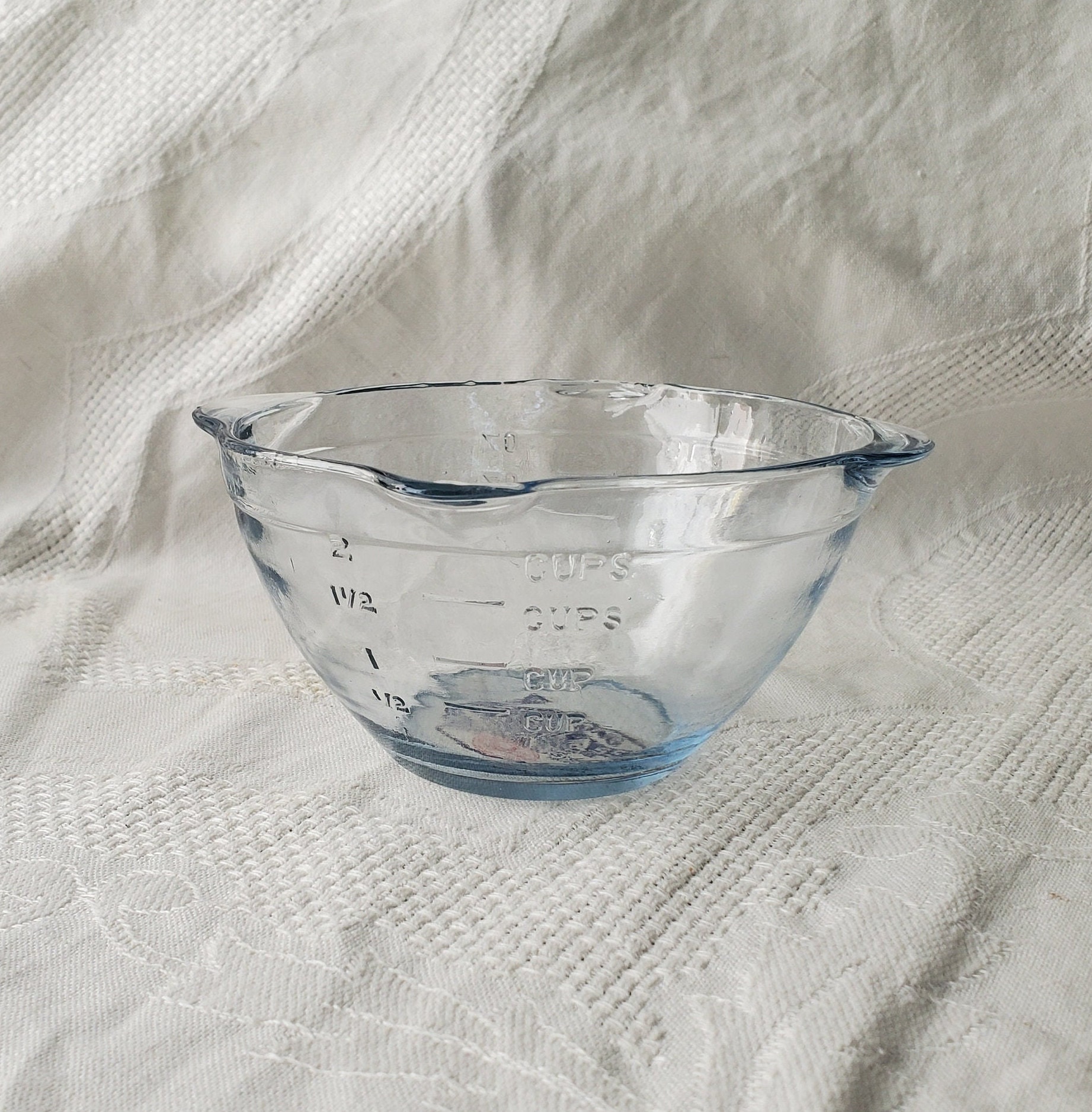 Confusing Measuring Cup with Reamer in Blue Glass