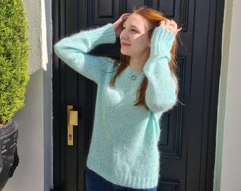 Angora mint knitted sweater with sequins and long sleeve. Warm winter jumper for woman.