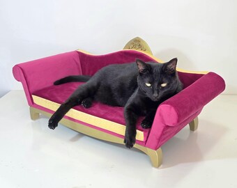 Pink velvet cat sofa.