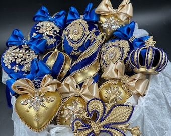 Set of Royal Blue and Gold christmas ornaments in the gift box. Velvet Gold Xmas hearts with bows. Blue Xmas bulbs with rhinestones.