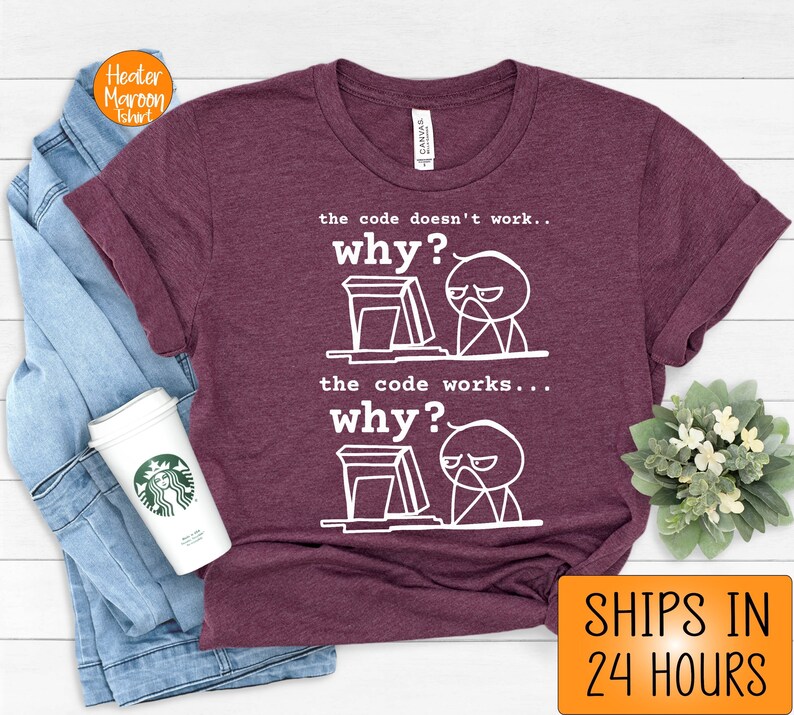 May include: A maroon t-shirt with a white graphic of a stick figure at a computer. The text on the shirt reads "the code doesn't work... why?" and "the code works... why?"