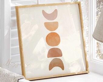 Op de afbeelding: Een ingelijst print met een minimalistisch ontwerp met een reeks van vijf abstracte maanvormen in tinten oranje, bruin en roze op een witte achtergrond.