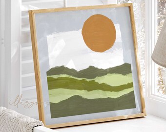 May include: A framed abstract landscape painting with a green and brown color scheme. The painting features a large orange sun in the upper right corner and a series of green hills in the lower portion of the painting.