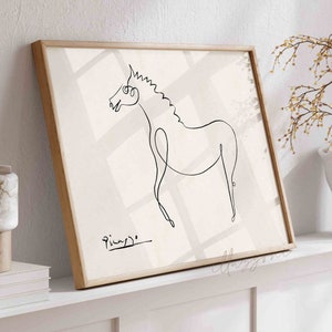 May include: A framed black and white line drawing of a horse, with the artist's signature "Picasso" in the bottom left corner.