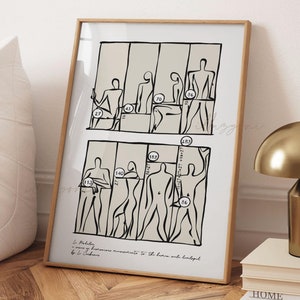 Puede incluir: Una impresión en blanco y negro de figuras humanas con medidas en centímetros. La impresión está enmarcada en un marco de madera clara y está colgada en una pared blanca. El texto en la parte inferior de la impresión dice "Le Corbusier,  Proportions harmonieuses  to the human scale and adapted by Le Corbusier."