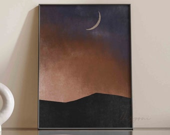 May include: A framed abstract print with a crescent moon in a purple and brown sky over a black mountain range.