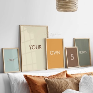May include: Five framed prints with different colors and text. The prints read "Pick", "Your Own", "5", "Prints", and a light yellow print with a shadow.