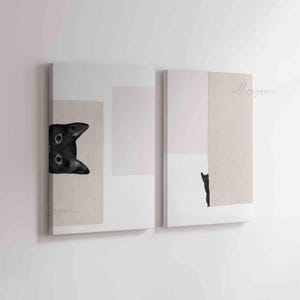 May include: Two abstract art prints featuring black cats peeking from behind geometric shapes in shades of beige and pink.