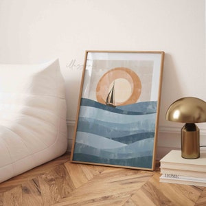 May include: A framed abstract art print with a sailboat on a blue and white wavy ocean with a large orange sun in the background.