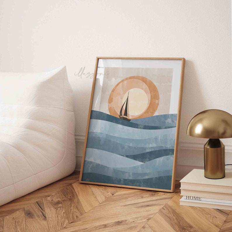 May include: A framed abstract art print with a sailboat on a blue and white wavy ocean with a large orange sun in the background.