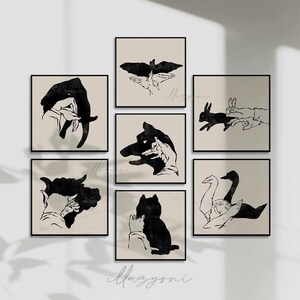 Peut inclure: Ensemble de six illustrations en noir et blanc de marionnettes d'ombres de main. Les illustrations représentent un oiseau, un lapin, un loup, un cygne, un chat et un chien.