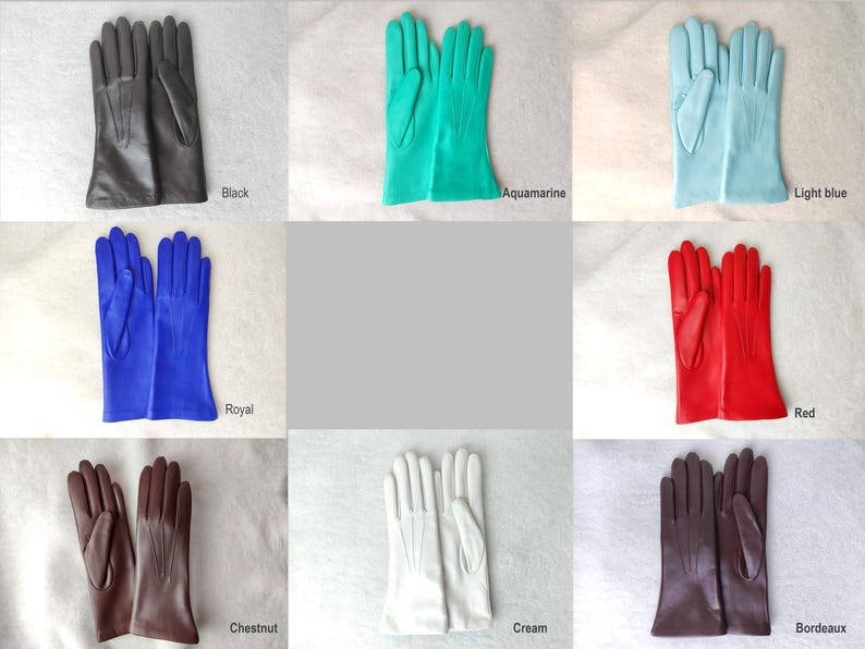 Peut inclure: Une collection de huit paires de gants dans diverses couleurs, notamment noir, aigue-marine, bleu clair, bleu roi, rouge, ch&acirc;taigne, cr&egrave;me et bordeaux. Chaque paire pr&eacute;sente trois lignes cousues verticales sur le dos de la main.