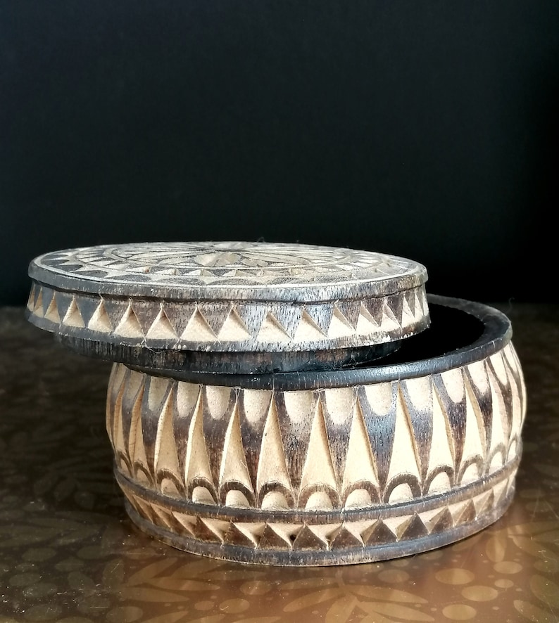 Hand made and tinted on the outer surface. Carved with flower and geometric pattern Unique Vintage Wooden Trinket Box
