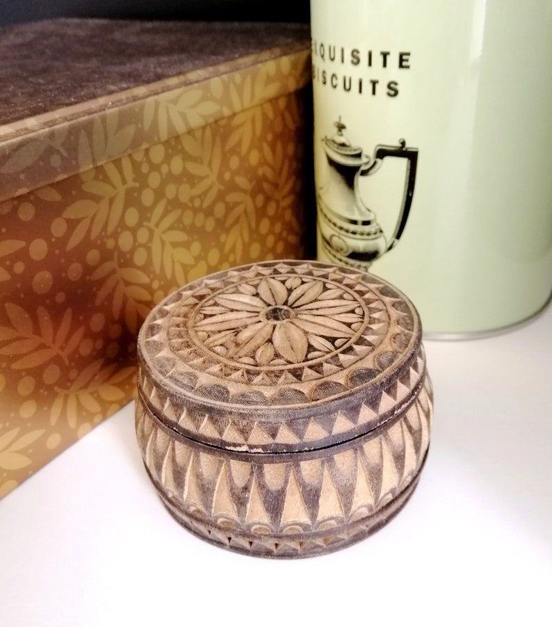 Hand made and tinted on the outer surface. Carved with flower and geometric pattern Unique Vintage Wooden Trinket Box
