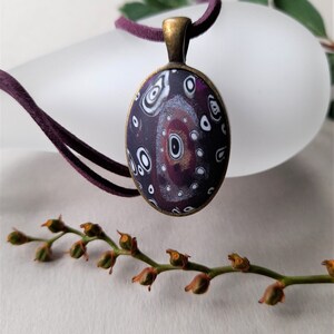 Retro concentric circle polymer clay handmade necklace and pendant, purple, crimson, black and white, satin finish, purple faux suede cord