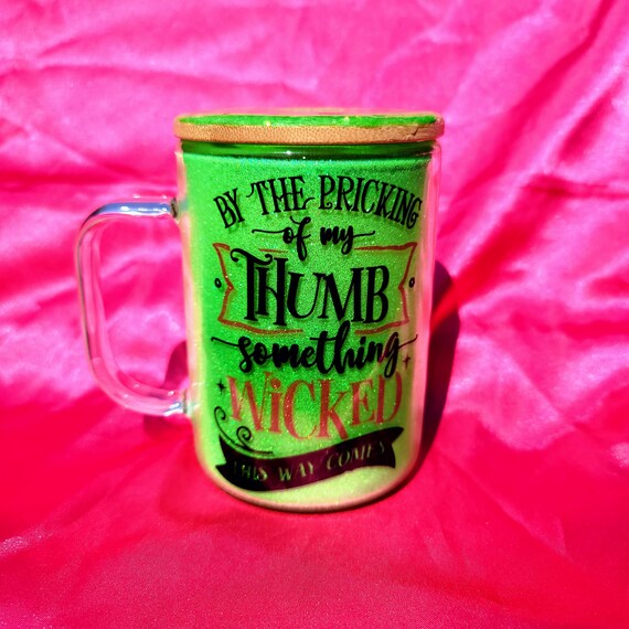 By the Pricking of My Thumb... Glass mug with glitter and decorated bamboo lid