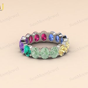 Multi sapphire oval shape wedding band featuring rainbow sapphires in 14k gold or sterling silver. 2