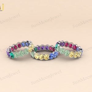 Oval-shaped multi sapphire wedding band featuring rainbow sapphires in 14k gold or sterling silver. 3