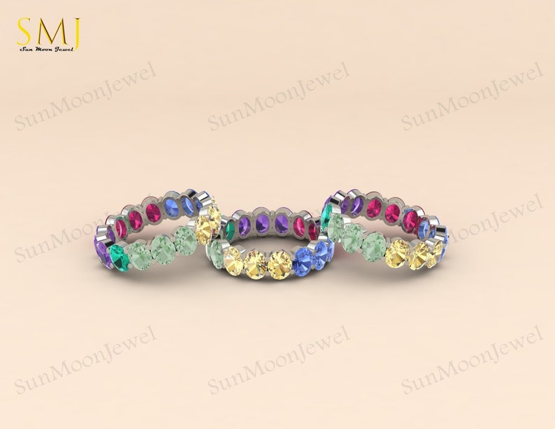 Oval-shaped multi sapphire wedding band featuring rainbow sapphires in 14k gold or sterling silver. 3
