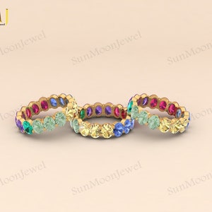 Oval-shaped multi sapphire wedding band featuring rainbow sapphires in 14k gold or sterling silver. 4