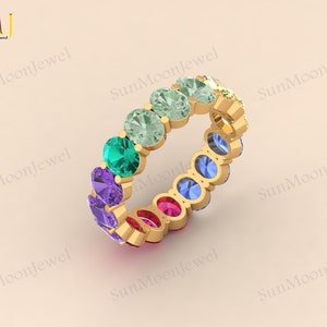 Multi sapphire oval shape wedding band with rainbow sapphires, available in 14k gold or sterling silver. 1