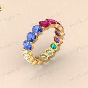 Oval-shaped multi sapphire wedding band featuring rainbow sapphires in 14k gold or sterling silver. 2