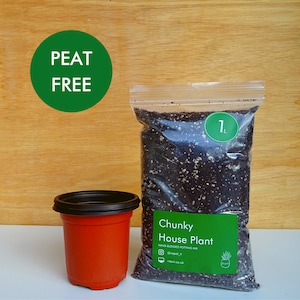 May include: A clear plastic bag of chunky house plant potting mix, labeled "1L", beside an empty orange plant pot. The bag has a green label with the text "Chunky House Plant" and "Peat Free" is written on a green circle.