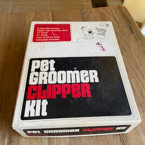 Vintage red Bakelite pet groomer clipper kit in original box
