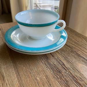 Vintage milk glass Pyrex cup and saucers with Aqua and gold trim