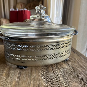 Vintage Pyrex dish with lid and metal carrier